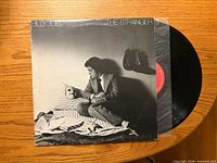 Front cover with record partially removed showing label