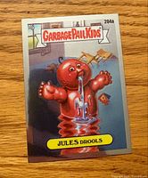 Front view of Garbage Pail Kids foil card Jules Drools #204a