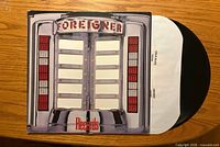 Front cover showing jukebox artwork with track list