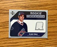 Front of Upper Deck Rookie Threads card showing player portrait, jersey swatch window, set branding