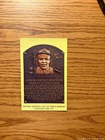 Front of postcard showing Jackie Robinson Hall of Fame plaque image and museum imprint