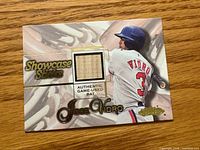 Front of Jose Vidro Showcase Sticks card showing wood bat piece, player image, branding