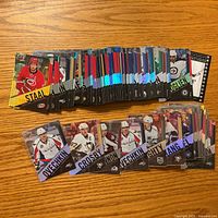 Spread of approximately 80 Tim Hortons NHL trading cards, showing various players and foil insert designs