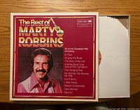 Front of The Best of Marty Robbins box with one record partially visible in sleeve