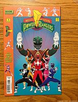 Front cover showing title, issue number, publisher, full team artwork