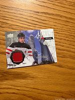 Front of Robby Fabbri jersey card showing image, red jersey swatch, branding