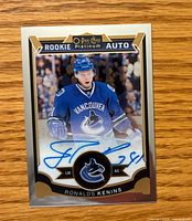 Front of Ronalds Kenins O-Pee-Chee Platinum Rookie Auto card showing autograph