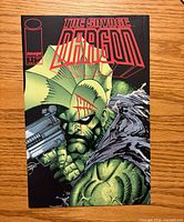 Front cover showing Savage Dragon with gun and title graphics