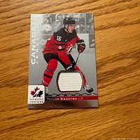 Front of trading card showing player image and jersey swatch