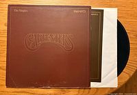 Front of album jacket with inner sleeve and record partially visible