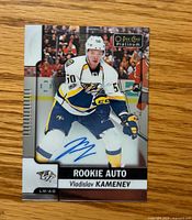 Front of autographed Vladislav Kamenev O-Pee-Chee Platinum Rookie Auto card with visible blue signature