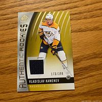 Front of Vladislav Kamenev SP Authentic Rookies jersey card with jersey swatch and serial number 173/399