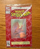 Front view of sealed Web of Spider-Man #90 comic showing hologram cover and polybag text