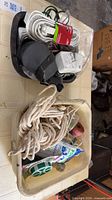 Overall lot with two trays holding cords, adapters and rope