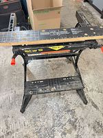 Full view of folded-out Workmate 550 showing platform, jaws and legs