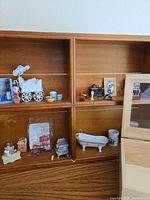 overall view of four-cubby wall shelf populated with miniatures