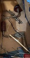 Bit brace, auger bits, caster wheel and wires in drawer