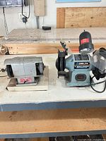 Front view of both bench grinders on workbench