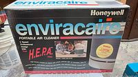 Front of box showing Honeywell Enviracaire branding and 300 CFM spec