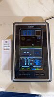 Front view showing active color display, sensor beside unit