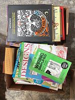 Box containing assorted quilting and embroidery books and magazines
