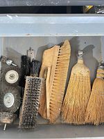 Drawer showing wire wheels, brushes, whisk brooms, drill bit
