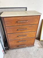 Front view of dresser showing five drawers and pulls