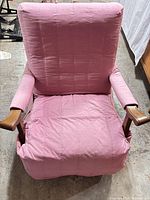Front view of rocking armchair with pink slipcover
