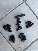 All lug nuts and key arranged on tile floor