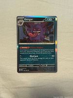 Front of Gengar holofoil card showing artwork, holo shine, card details