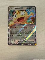 Front of the Mega Starmie EX card showing artwork, HP, attacks and holographic finish
