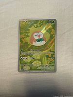Front of Rowlet Illustration Rare card showing artwork, set number and near-mint surface