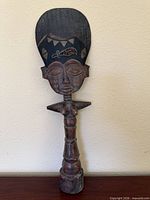 Full front view of carved wood Ashanti fertility doll