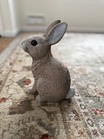 Left side view of rabbit lawn ornament