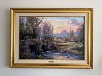 Full view of framed Thomas Kinkade Cobblestone Evening canvas on wall