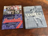 Both hardcover baseball books side by side