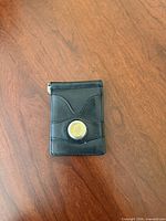 Front of wallet showing Liberty dime inlay and card slots