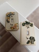 Both FIGI Bella Rosa floral switch covers displayed together
