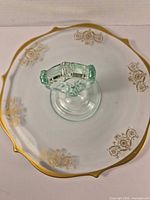 Top view showing entire cake stand, gold floral decals and gilt rim.