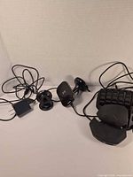 Group view showing Razer keypad, Qi charger pad, suction mount, wall charger, cable