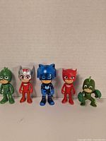 Front view of all five PJ Masks figures standing in a row
