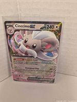 Front view of Cinccino EX card showing artwork, HP, and holo pattern