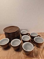 Entire set: 8 cups and stack of saucers
