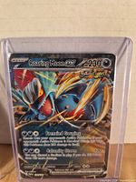 Front view of Roaring Moon ex card in top-loader