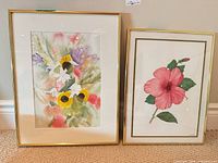 Both framed paintings side by side