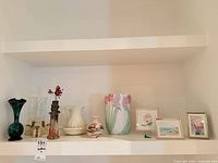 full group on shelf showing all vases, figurine and framed art