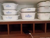 Stack of eight casserole dishes showing both size groups