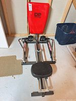 Full view of DP BodyTone 500 rowing machine with seat, back pad, and hydraulic arms