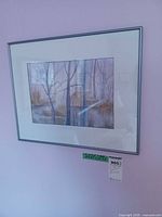 Full view of framed landscape print on wall