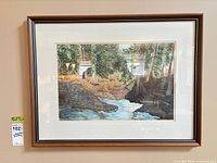 Full view of framed watercolor on wall